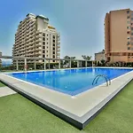 Estudio frente al mar con parking y piscina